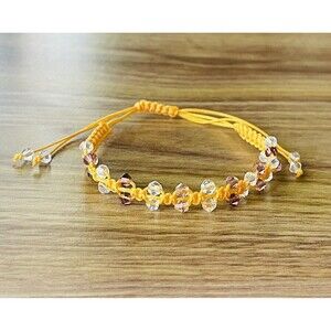 Yellow women's bracelet braided with crystals
